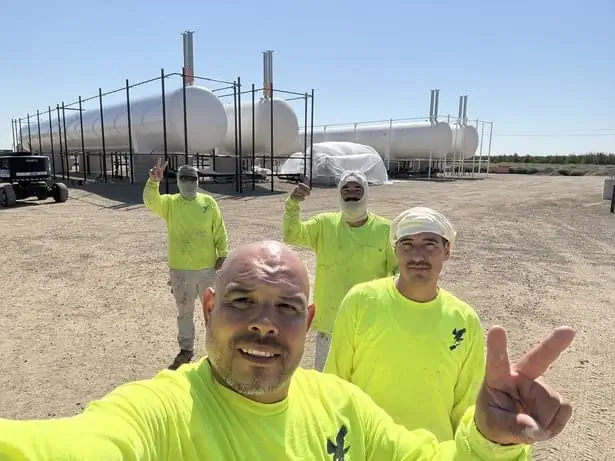 Four of Blackhawk Painting, Inc. industrial painting team members at TransTech Energy LPG Terminal in Arbuckle, CA.