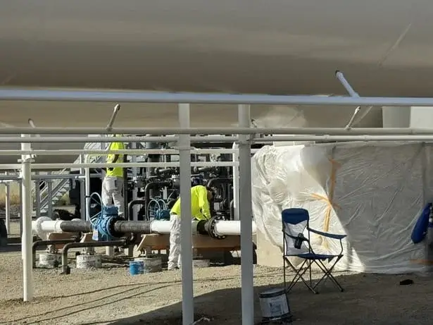 LPT pipes being prepped according to Steel Surface Preparation industry standards by Blackhawk Painting, Inc. team.